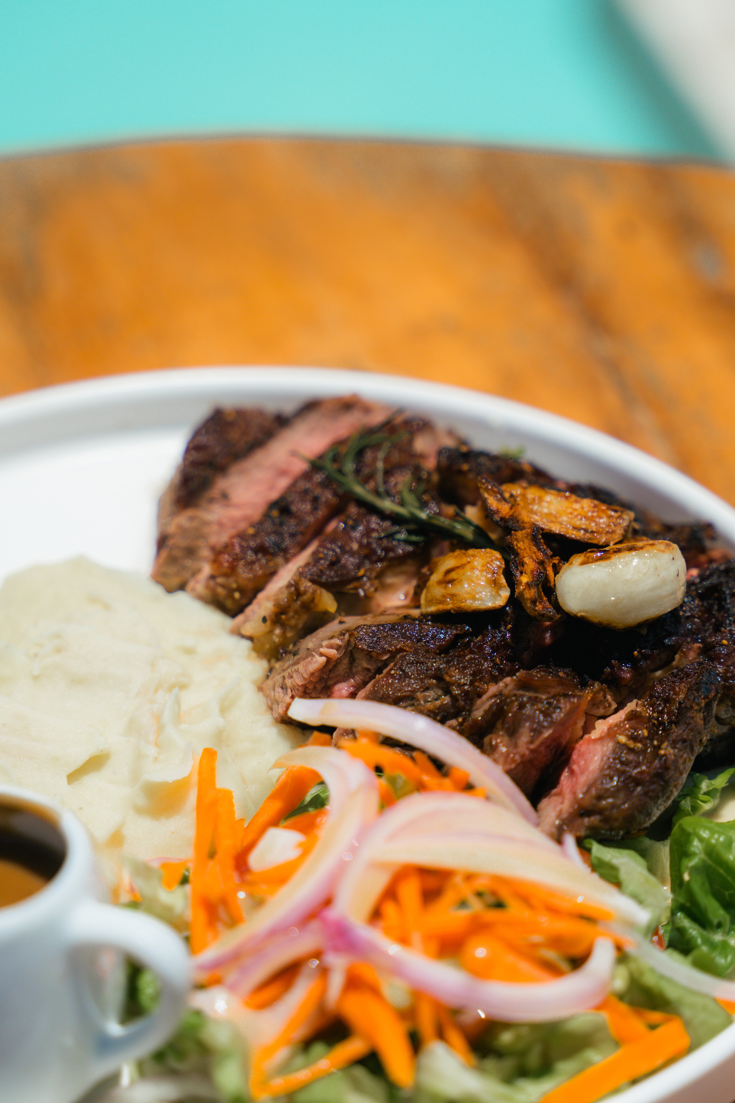 Premuim cut of steak served with salad and mash