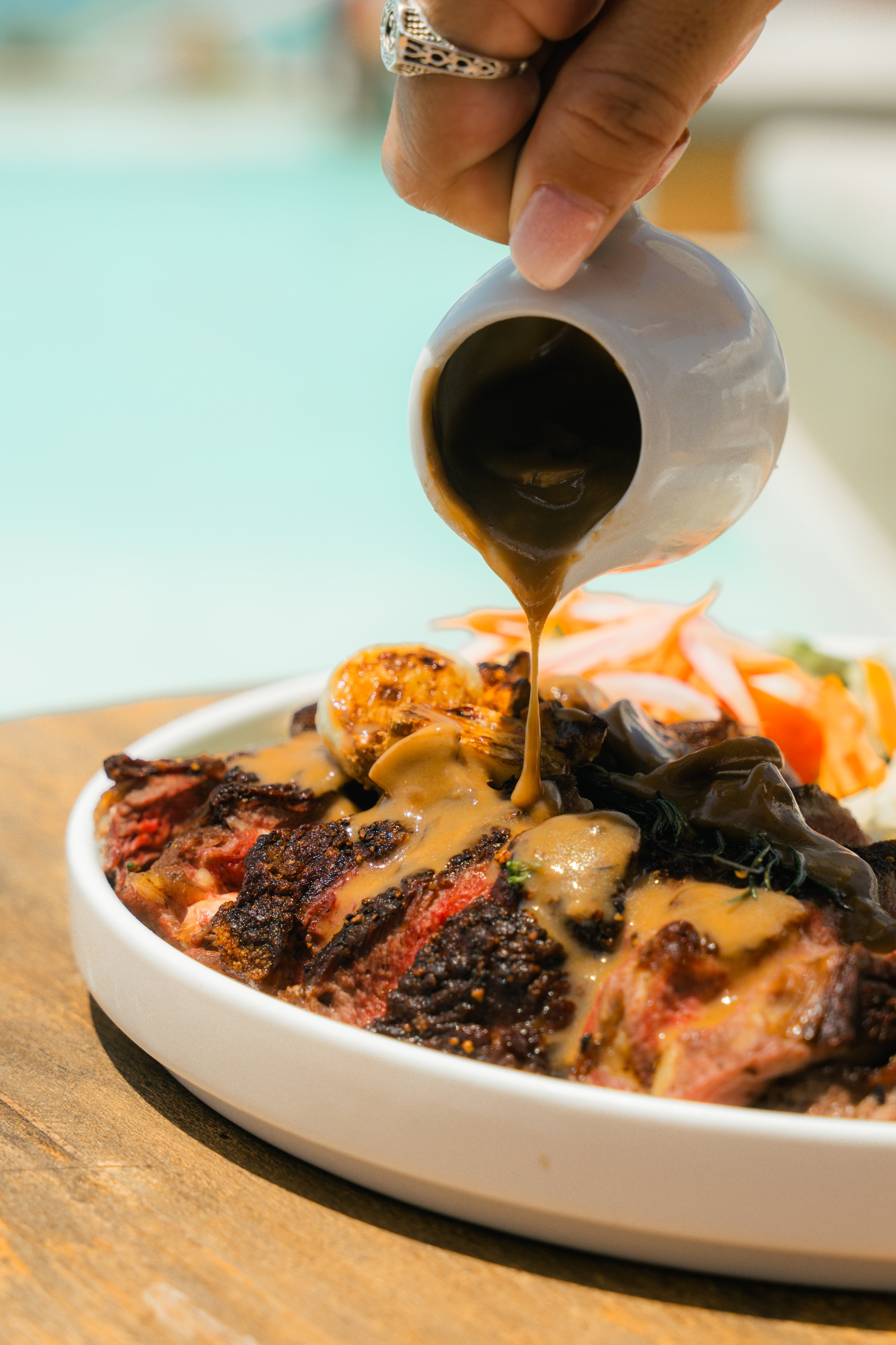 Steak served with gravy, salad and mash
